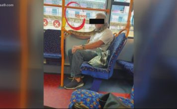 Live snake used as face mask on British Bus!